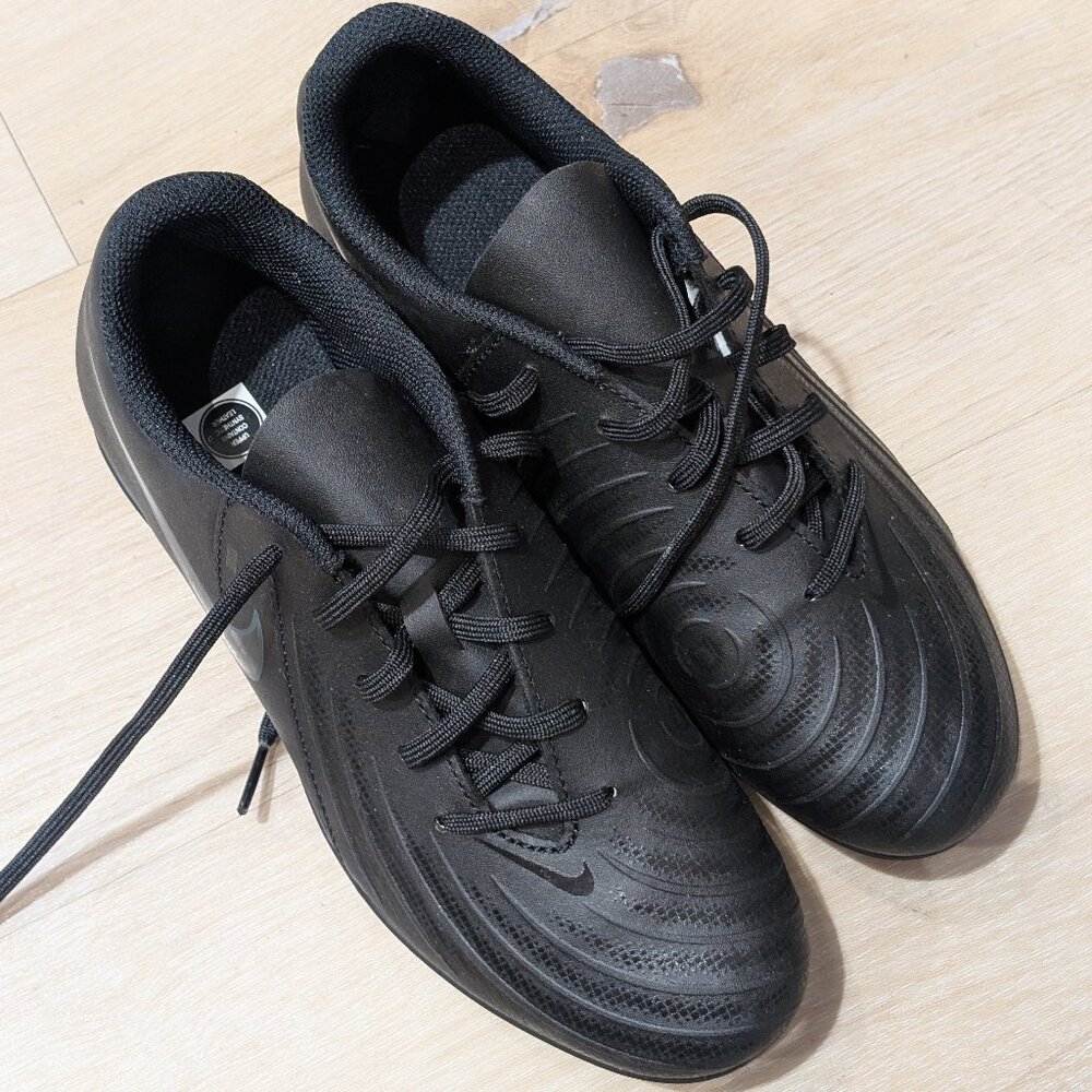 Boys black Nike soccer cleats in size 5.5